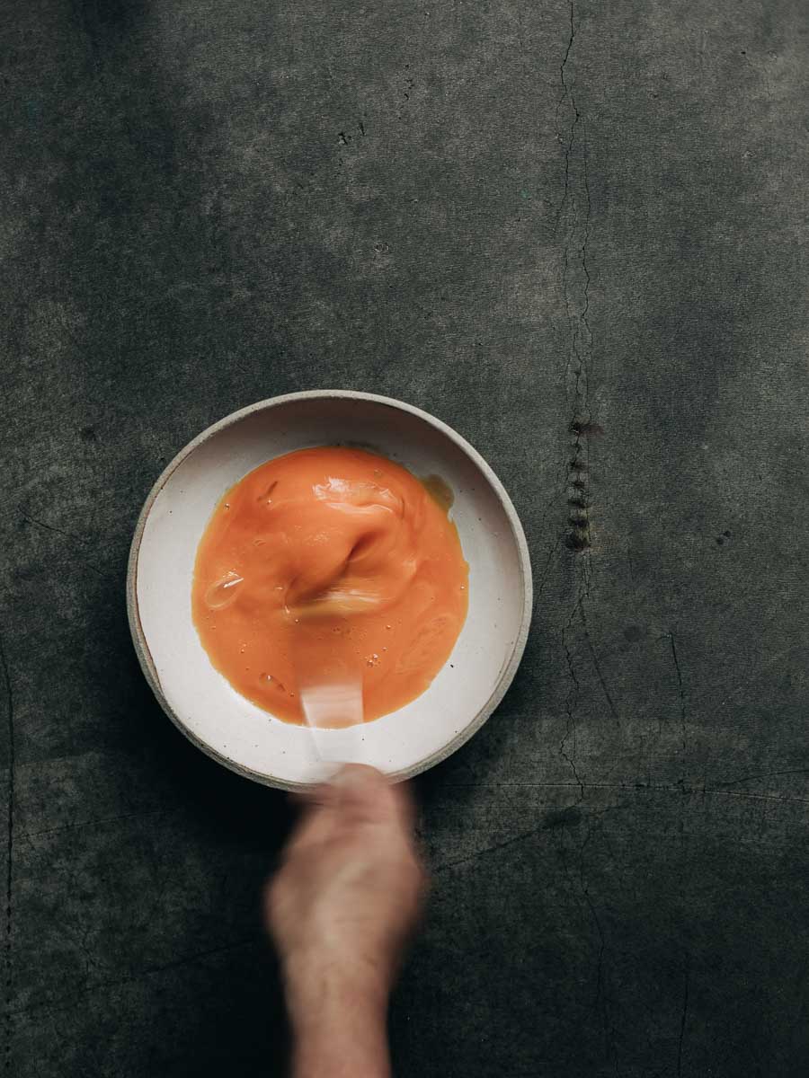 Six egg yolks whisked by hand